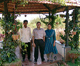 Baskar Subramanian, center, his mother (right) and gardener (left).